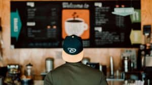 Person looking at a menu board